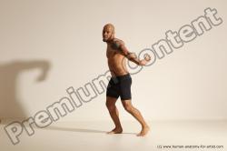 Underwear Gymnastic poses Man Black Muscular Bald Dancing Dynamic poses Academic